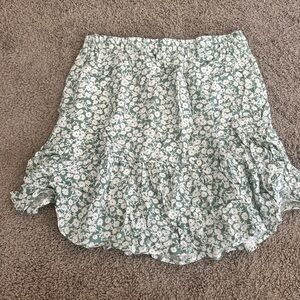 Mini skirt size medium. Green and white floral. Loose fitting and comfortable.
